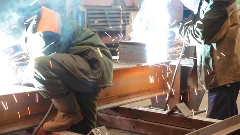 Workers welding a metal construction Stock Footage 76283496