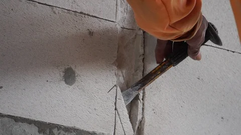 Workers were using a hammer drill to extract a concrete wall  Video stock 112948344