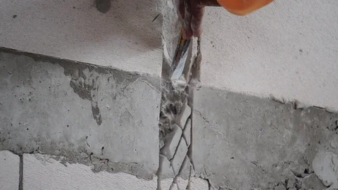 Workers were using a hammer drill to extract a concrete wall  Stock Footage 112948389