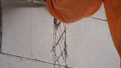 Workers were using a hammer drill to extract a concrete wall  Stock Footage 112948641