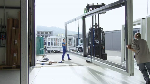 Workers in a window factory preparing a shipment to leave. Stock Footage 63014153