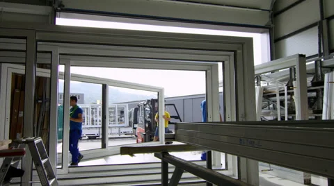 Workers in a window factory preparing a shipment to leave. Stock Footage 63017222