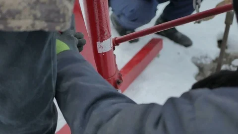 Workers work with a hydraulic hoist Stock Footage 73820801
