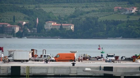 Workers work at Port of Koper terminal. Seafront construction site Stock Footage 158494326