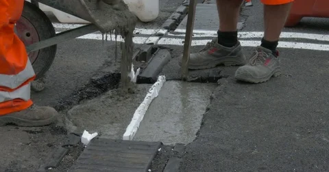 Workers at work on the road, repairing an expansion joint on a bridge, Video stock 83659618
