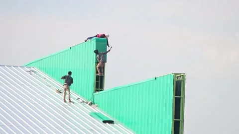 Workers work on the roof of the hall Stock Footage 315431089
