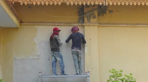 Workers at work in the Royal Palace complex in Phnom Penh Stock Footage 68064445