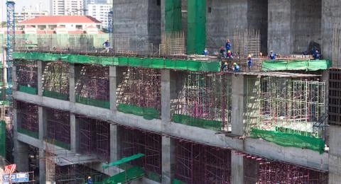 Workers work structure metal construction site  in bird-view . Stock Photos