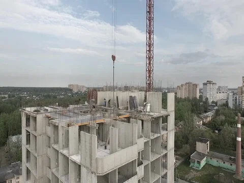 Workers working on the construction of an apartment building Stock Footage 76102661