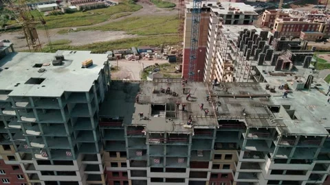 Workers working at a construction site. Builders are building concrete pouring Video stock 166020812