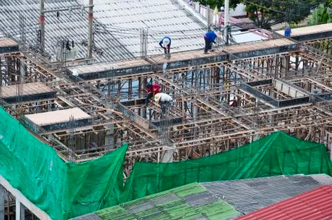 Workers working in a construction site Stock Photos