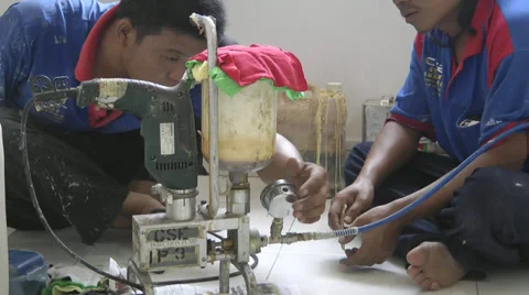 Workers working on injection pump Stock Footage 39847354