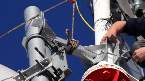 Workers working on the installation of telecommunication antennas climb to great Stock Footage 64148408