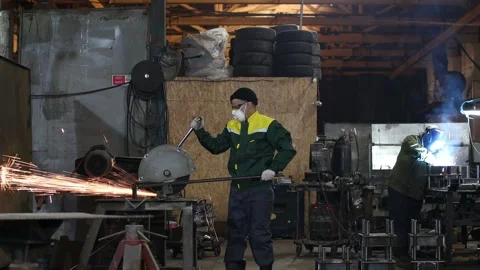 Workers working with metal construction on plant. Metal processing with big Stock Footage 168976379