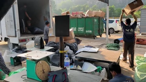 Workers working in a recycling scarp yard Stock Footage 303008523