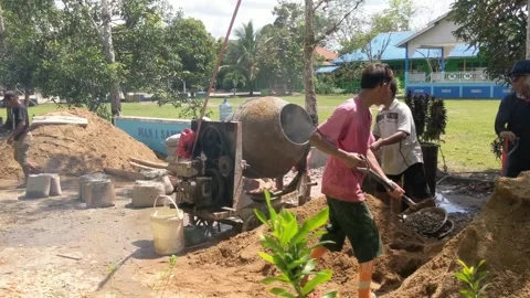 Workers working on road construction Stock Footage 322558407