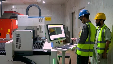 Workers Working As A Team, Programming A Steel Cutting Automated CNC Machine On 스톡 동영상 328135502