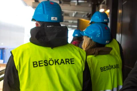 Workers in yellow flags in Sweden Stock Photos