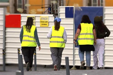Workers in yellow vests Stock Photos