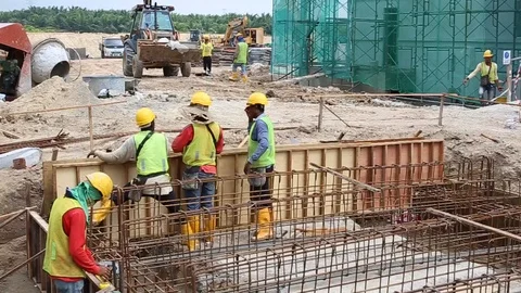 Workes doing works at the large scale of solar farm Stock Footage 96019006