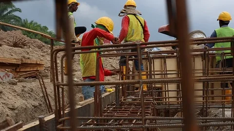 Workes doing works at the large scale of solar farm Stock Footage 96019189