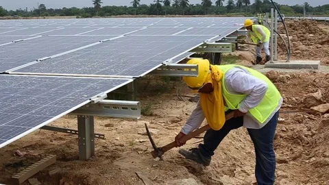 Workes doing works at the large scale of solar farm Stock-Footage 96021490