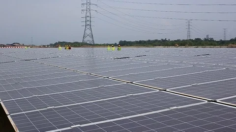 Workes doing works at the large scale of solar farm Stock Footage 96021732