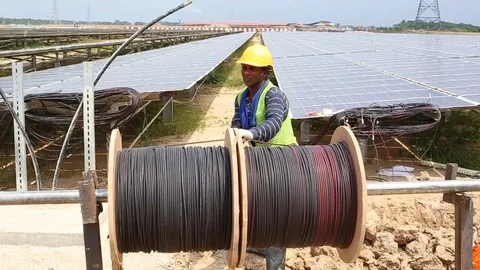 Workes doing works at the large scale of solar farm Stock-Footage 96021943