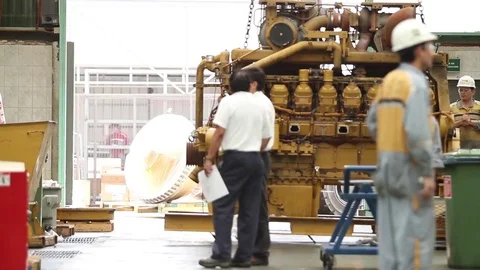 Workes operate machinery Stock-Footage 77099884