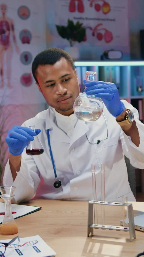 Workflow in chemical laboratory where likable responsible experienced young afri Stock Footage 330804468