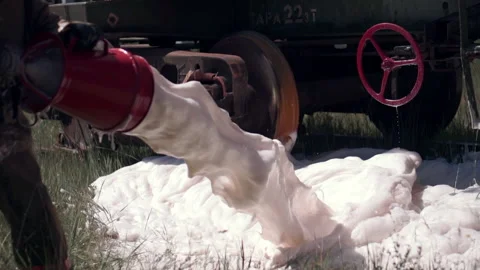 Workflow. Clip. Firefighters in uniform check the equipment and pour foam and Video stock 165900784