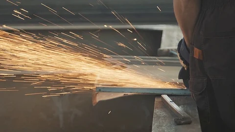 Workflow of a factory worker using tools for working with metal parts Stock Footage 125881286