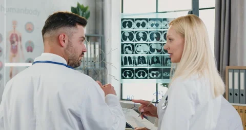 Workflow in hospital where attractive confident qualified smart diverse doctors Stock Footage 160428162
