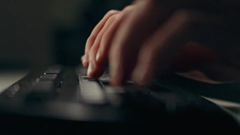 Workflow of a man at a table with a laptop computer, hands deftly moving on Stockbeeldmateriaal 256935227