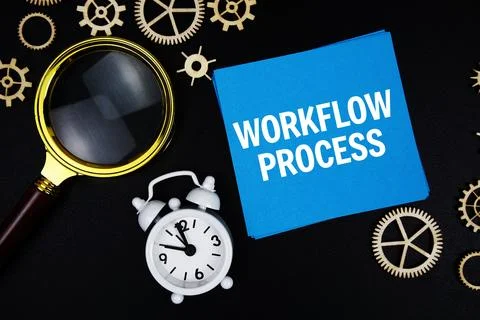 Workflow Process text message on sticky note with magnifying glass and alar.. Stock Photos