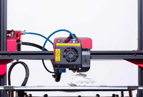 Working 3d printer. Printhead with hotend and fan close-up. Isolated on white Stock Photos