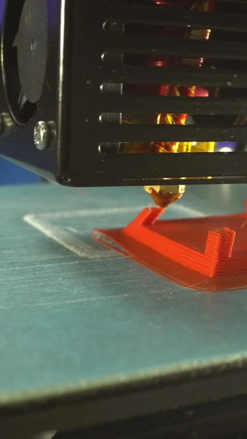 Working 3D printer prints the mechanical part is made of red plastic Stock Footage 249047949
