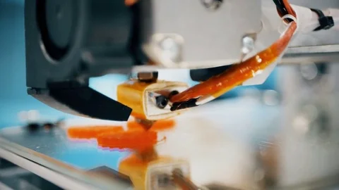 Working 3d printer sequence. Printing with Plastic Wire Filament on 3D Printer Stock Footage 82546492