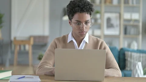 Working African Girl Using Her laptop on Her Table Stock-Footage 114774699