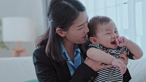 Working and Comforting Her Son Mid-Adult Woman Talking Stock Footage 303542066
