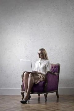 Working in an armchair Stock Photos