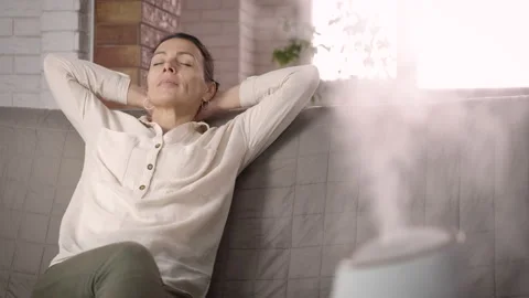 Working aromatherapy diffuser by female. Video stock 221721804