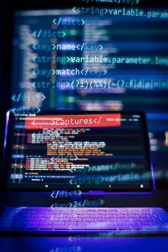 Working atmosphere of a programmer at home, background. Programming code ab.. Stock Photos