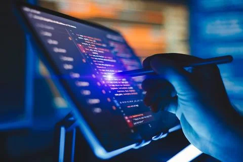 Working atmosphere of a programmer at home, IT business. Monitor closeup of.. Stock Photos