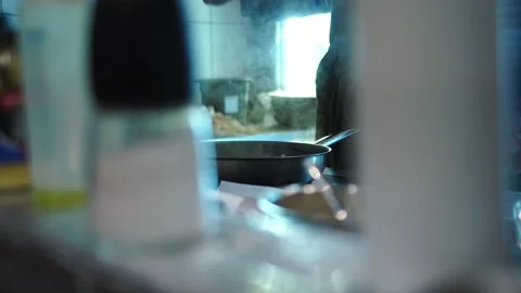 Working atmosphere in the restaurant kitchen. Chefs are preparing the dish. Stock Footage 141246363