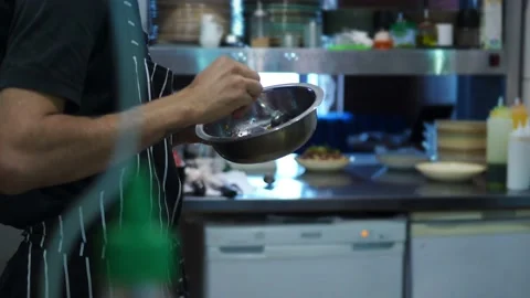 Working atmosphere in the restaurant kitchen. Chefs are preparing the dish. Stock Footage 141420411