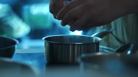 Working atmosphere in the restaurant kitchen. Chefs are preparing the dish. Stock Footage 141421514