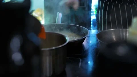 Working atmosphere in the restaurant kitchen. Chefs are preparing the dish. Stock Footage 141790928