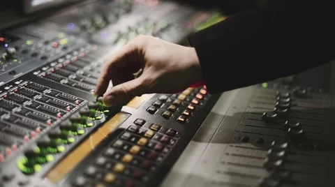 Working on a audio mixing console, sound mixer Stock Footage
