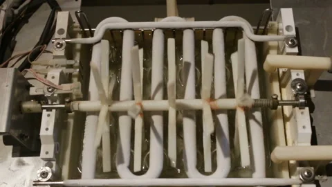 Working automatic ice-making plant in real time. The zigzag metal heat exchanger Stock Footage 129896684